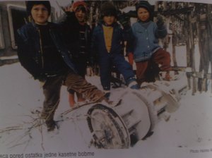 Bosniak children stand by remains of a  cluster bomb which was aimed at civilian objects in Gorazde.